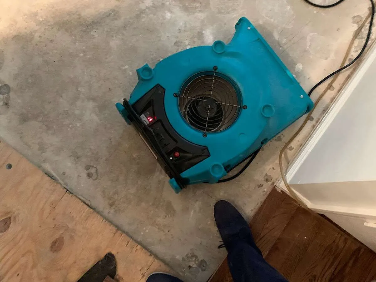 Air mover drying subfloor during Leak Detection & Repair in La Mirada